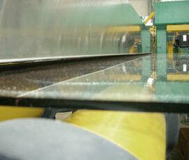 depowdering unit for the glass industry